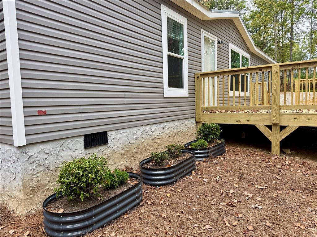 57 Highland Tree Court Ranger, GA 30734 - Photo 8 of 39 a view of a backyard with chairs and a fire pit
