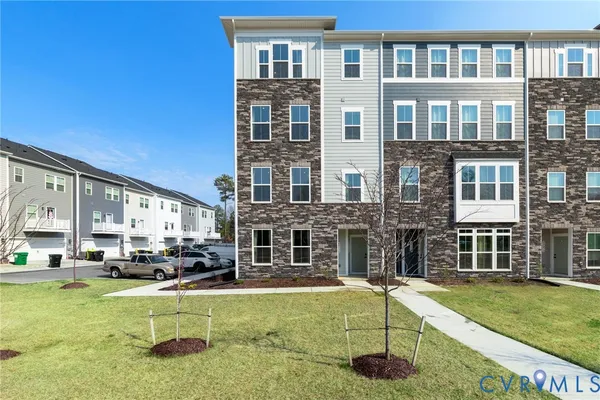 a view of an apartment with a swimming pool