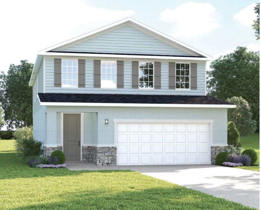 2518 White Ladyfish Road Wimauma, FL 33598 - Photo 1 of 21 a front view of a house with a yard and garage