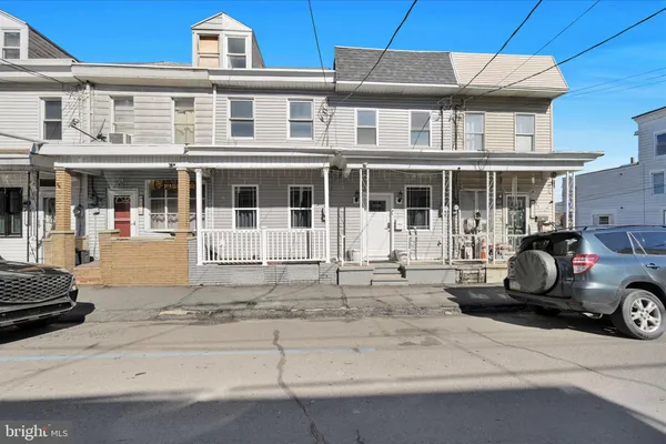a car parked in front of a house