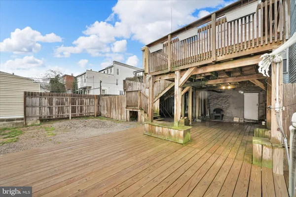 a view of a house with wooden stairs