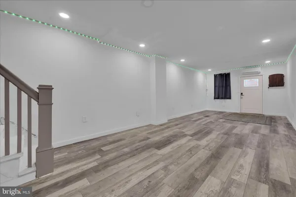 a white toilet sitting next to a bathroom sink