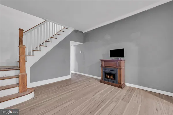 a view of an empty room with stairs