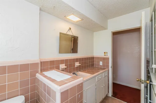 a bathroom with a shower and a bathtub