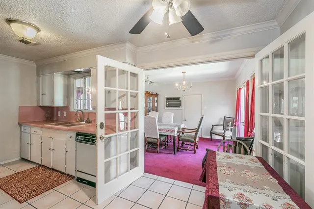 a spacious bathroom with a double vanity sink mirror and shower