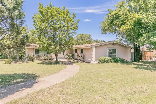 a view of backyard with green space