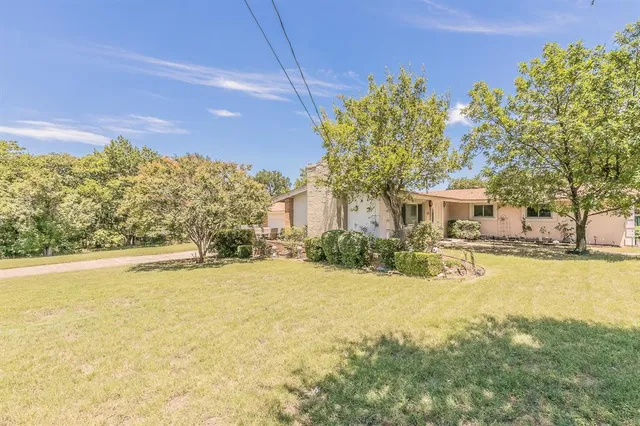 a view of house with outdoor space