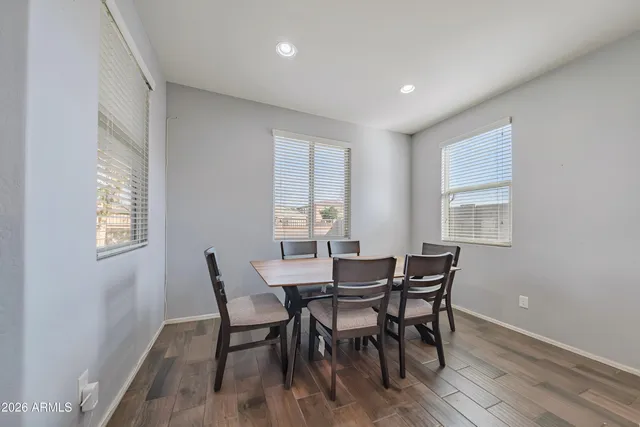 a view of a dining room with furniture and window