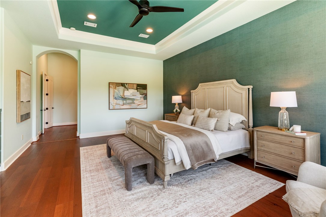 2833 Persimmon Ridge Court Bryan, TX 77807 - Photo 39 of 50 a spacious bedroom with a bed and a couch