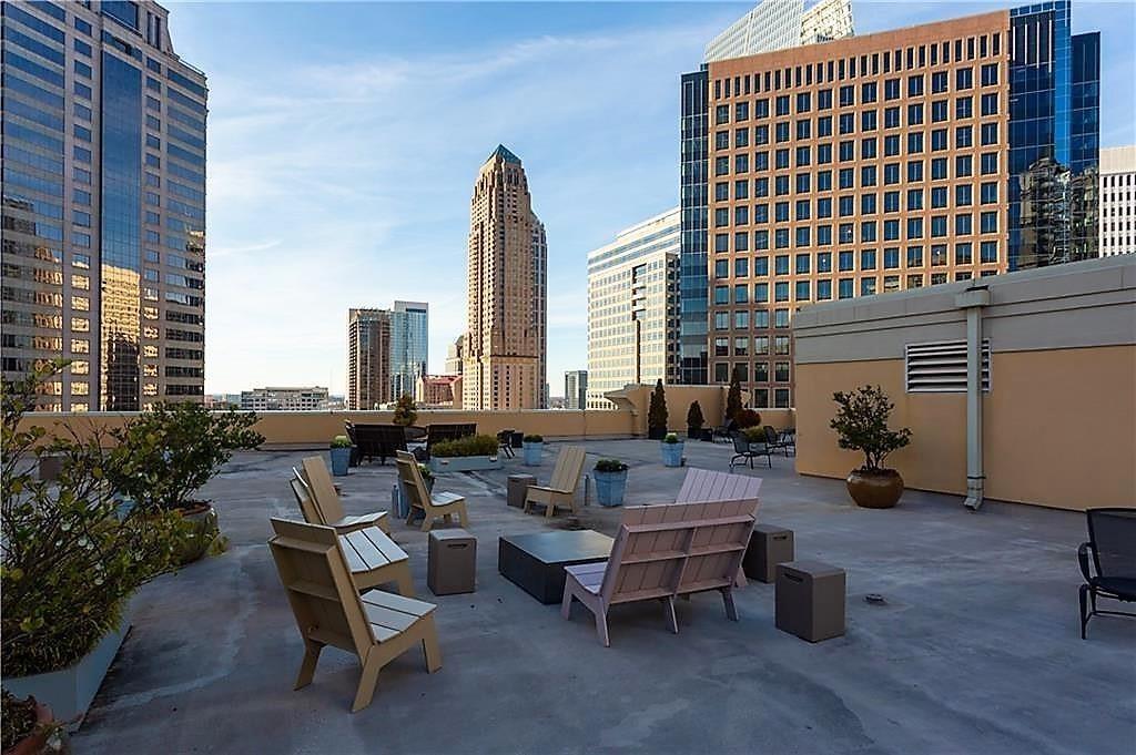 1101 Juniper Street Northeast, Unit 1416 Atlanta, GA 30309 - Photo 21 of 48 a building outdoor space with patio furniture