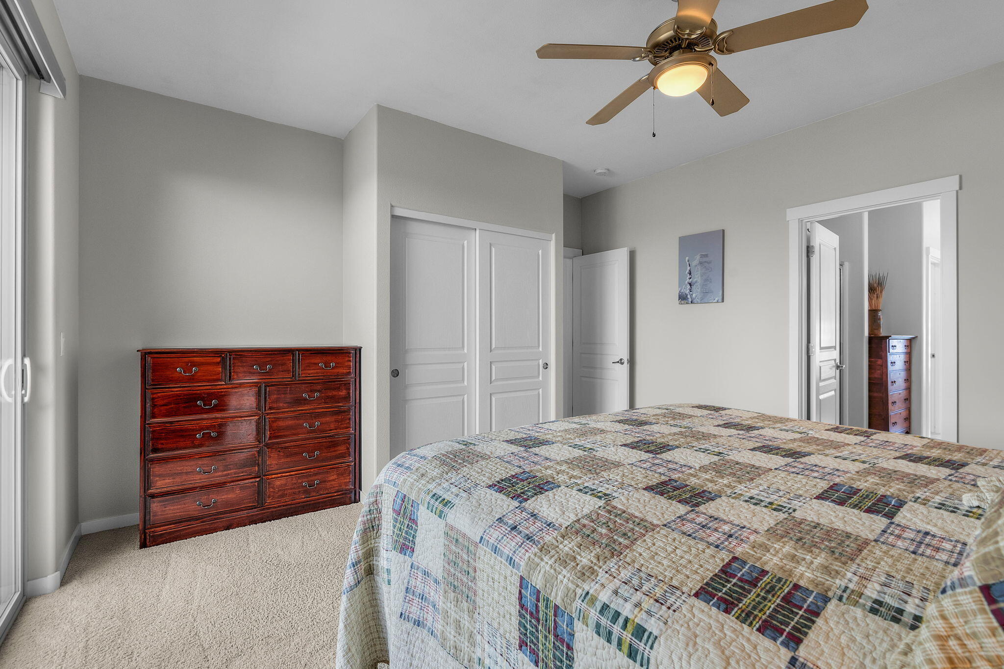 10870 Village Loop Redmond, OR 97756 - Photo 10 of 35 a bedroom with a bed and a dresser