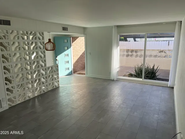 a view of a bathroom from a hallway