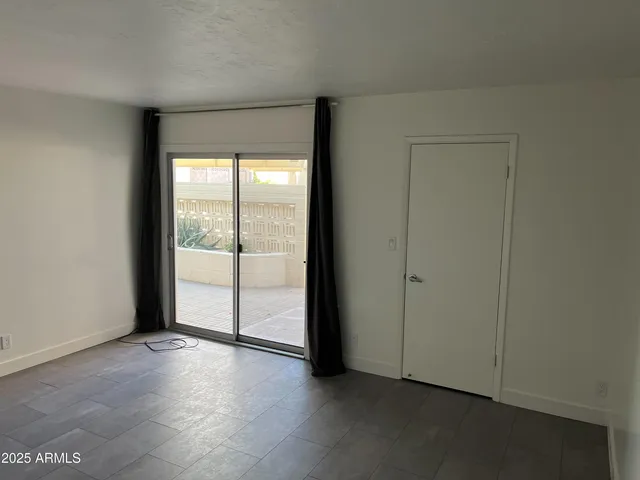 an empty room with sliding door