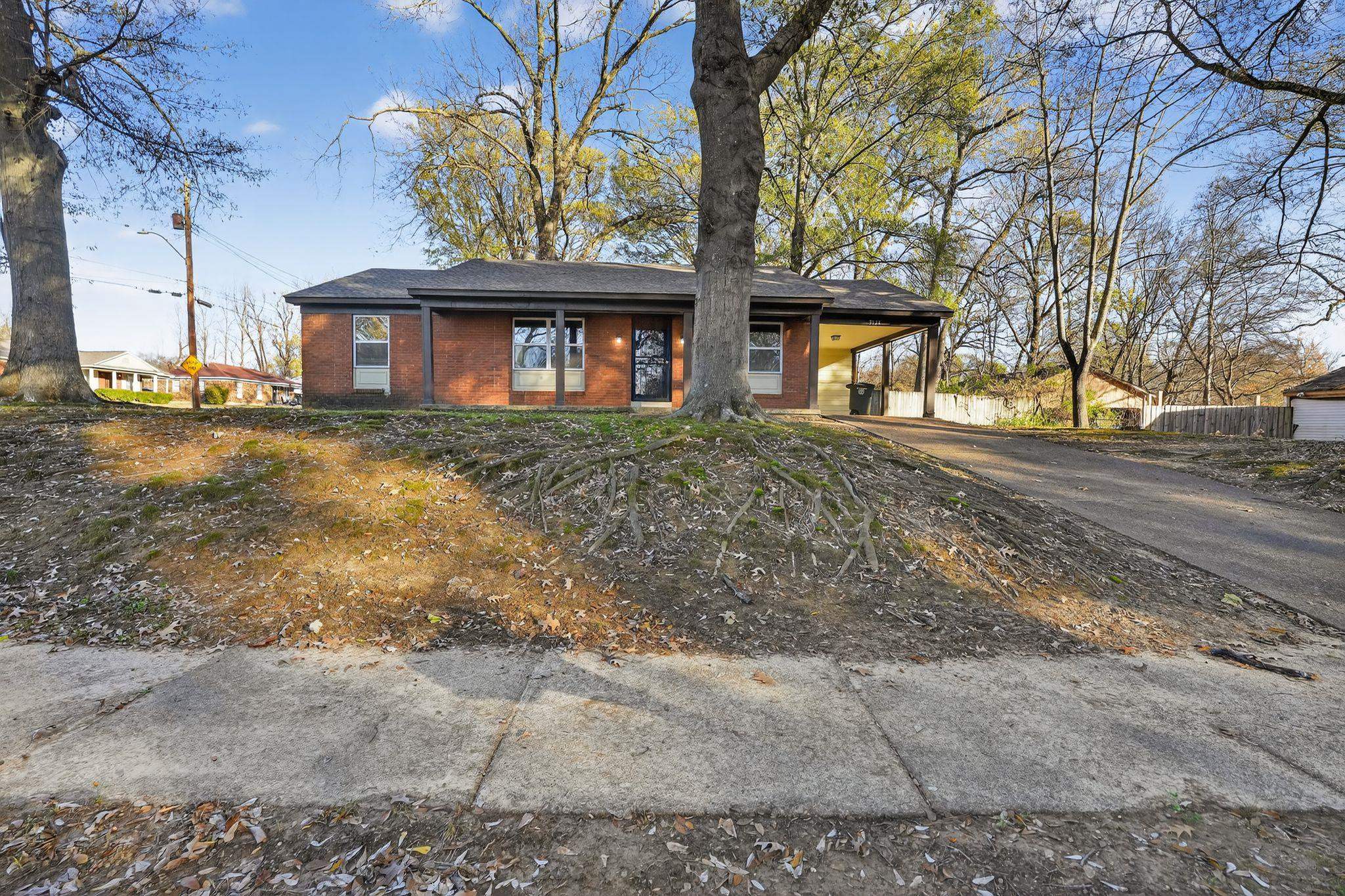 3124 Boone Street Memphis, TN 38127 - Photo 11 of 30 a front view of a house with a yard