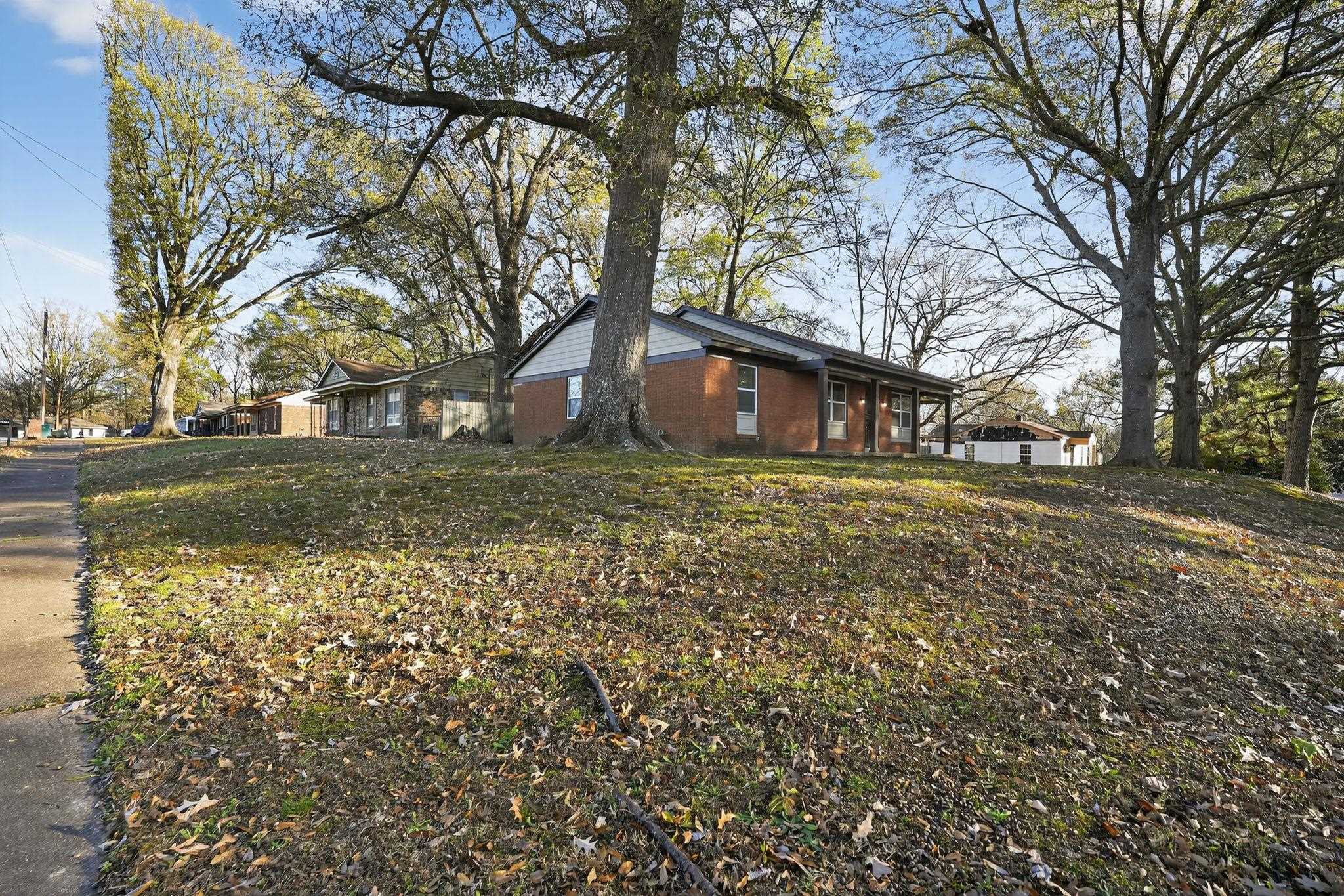 3124 Boone Street Memphis, TN 38127 - Photo 14 of 30 front view of a house with a yard