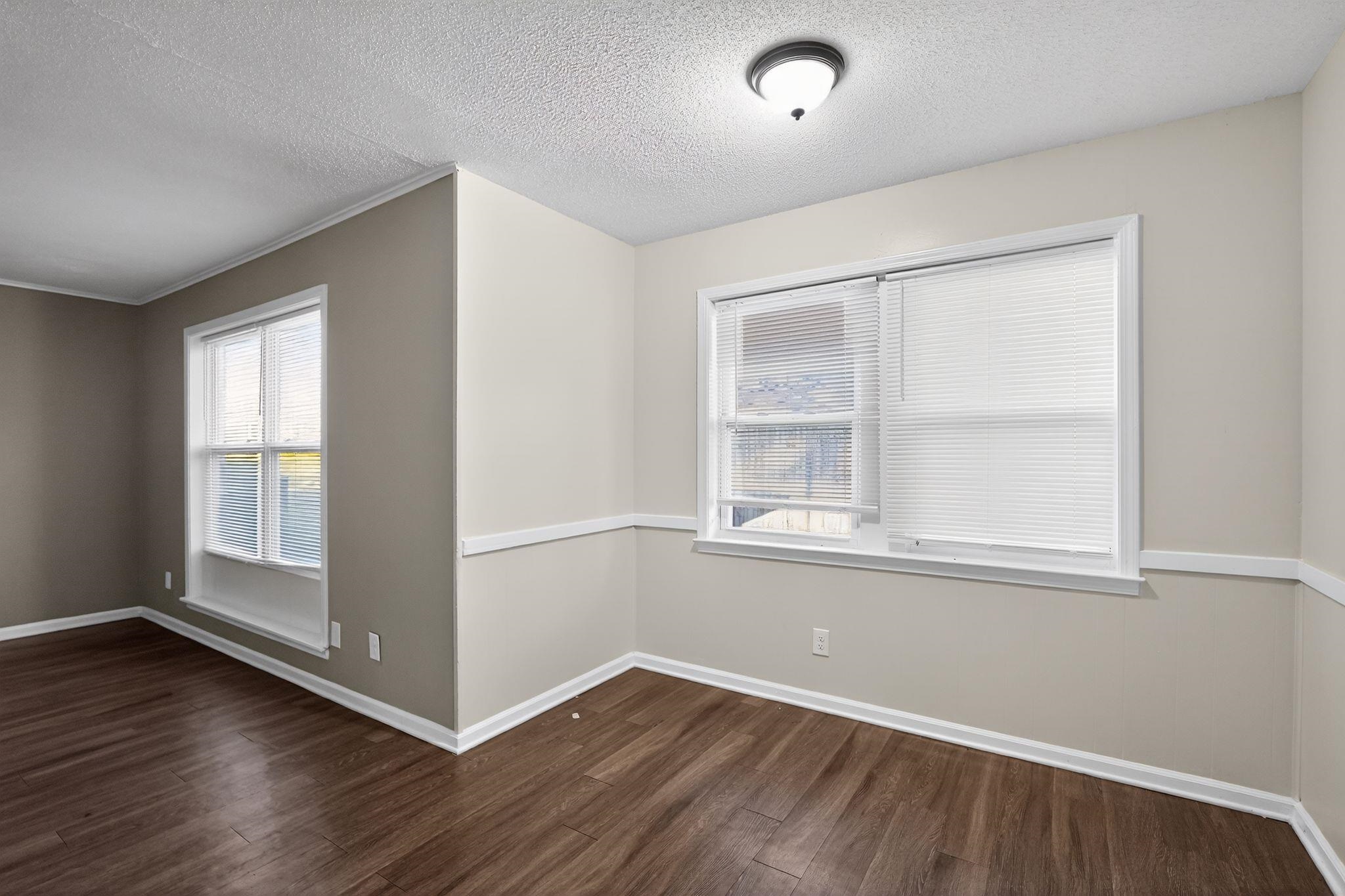3124 Boone Street Memphis, TN 38127 - Photo 19 of 30 an empty room with wooden floor and windows