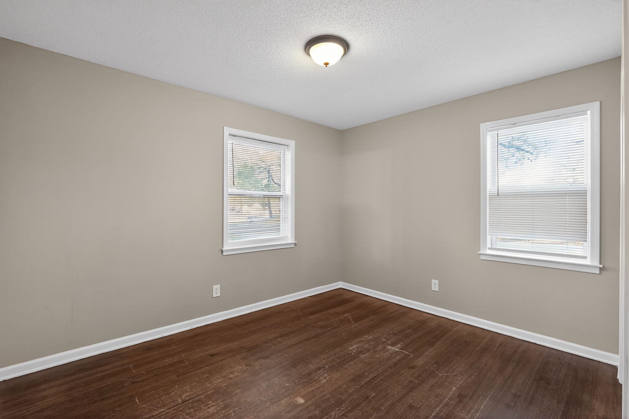 3124 Boone Street Memphis, TN 38127 - Photo 20 of 30 an empty room with wooden floor and windows