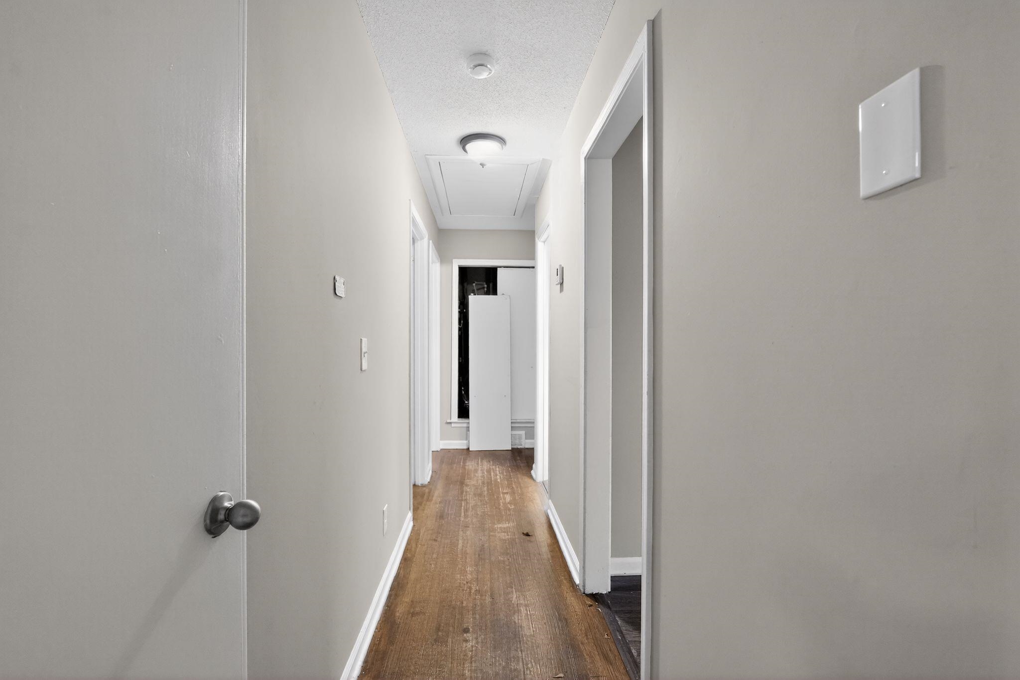 3124 Boone Street Memphis, TN 38127 - Photo 27 of 30 a view of a hallway with wooden floor and closet