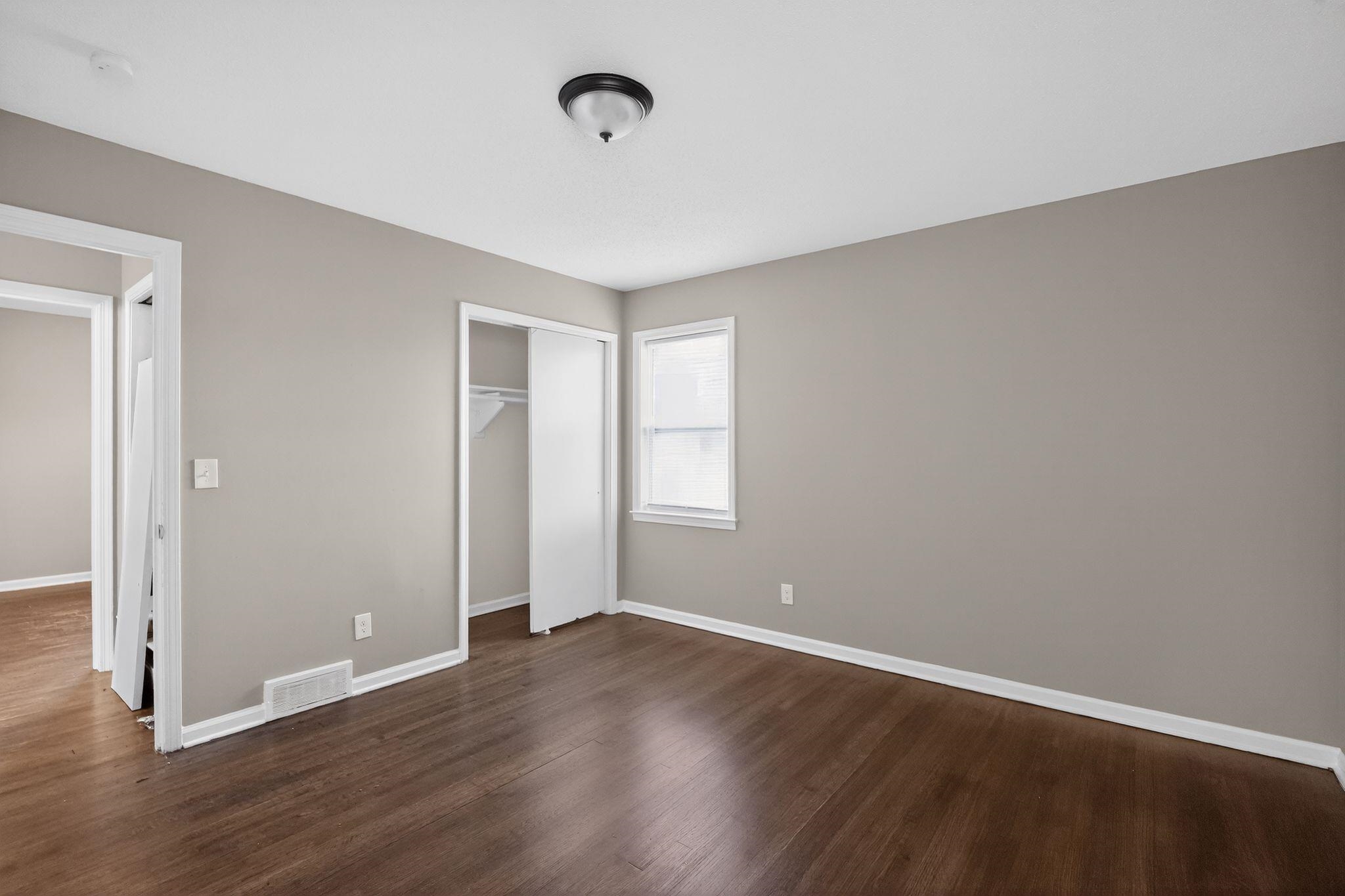 3124 Boone Street Memphis, TN 38127 - Photo 9 of 30 a view of a room with wooden floor and windows