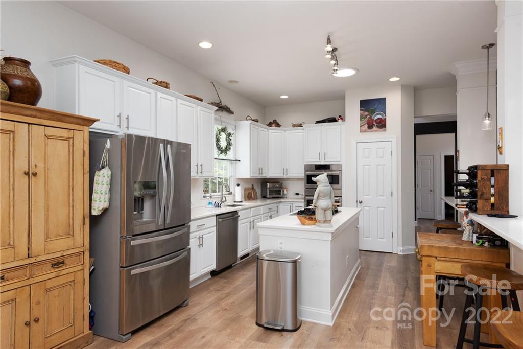 8804 Brentfield Road Huntersville, NC 28078 - Photo 13 of 39 a kitchen with a refrigerator a sink and a refrigerator
