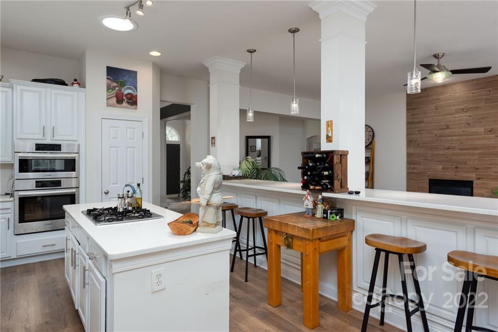 8804 Brentfield Road Huntersville, NC 28078 - Photo 14 of 39 a kitchen that has a table chairs and a stove
