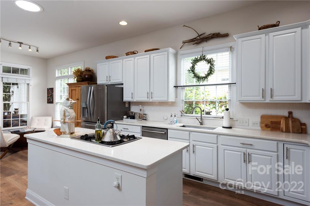 8804 Brentfield Road Huntersville, NC 28078 - Photo 15 of 39 a kitchen with kitchen island granite countertop a sink appliances cabinets and furniture