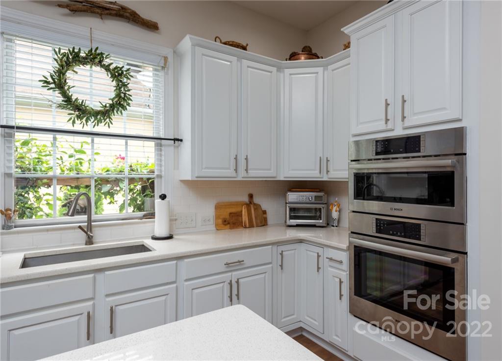 8804 Brentfield Road Huntersville, NC 28078 - Photo 17 of 39 a kitchen with appliances a sink and a window
