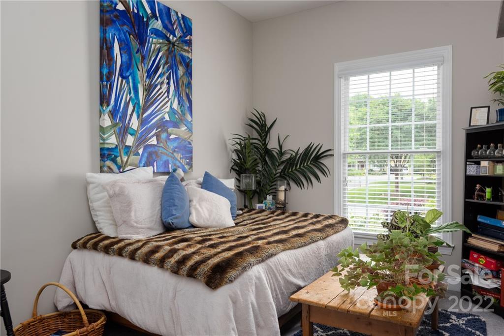 8804 Brentfield Road Huntersville, NC 28078 - Photo 21 of 39 a bedroom with a bed and a painting on the wall