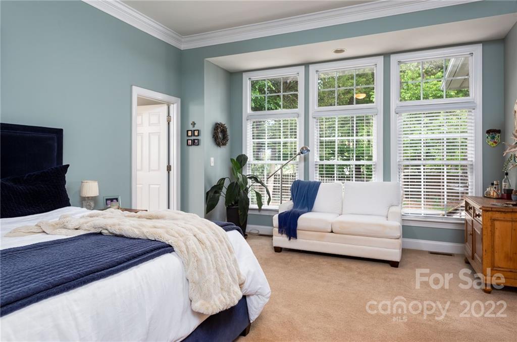 8804 Brentfield Road Huntersville, NC 28078 - Photo 28 of 39 a bedroom with a bed couch and a large window