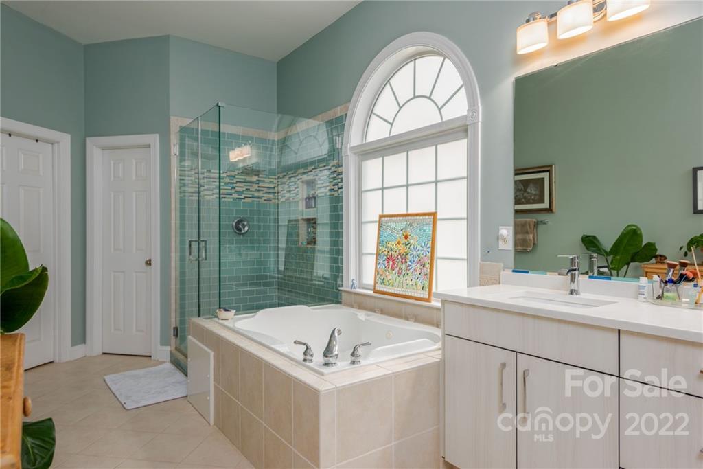 8804 Brentfield Road Huntersville, NC 28078 - Photo 29 of 39 a bathroom with a sink a bathtub and a shower