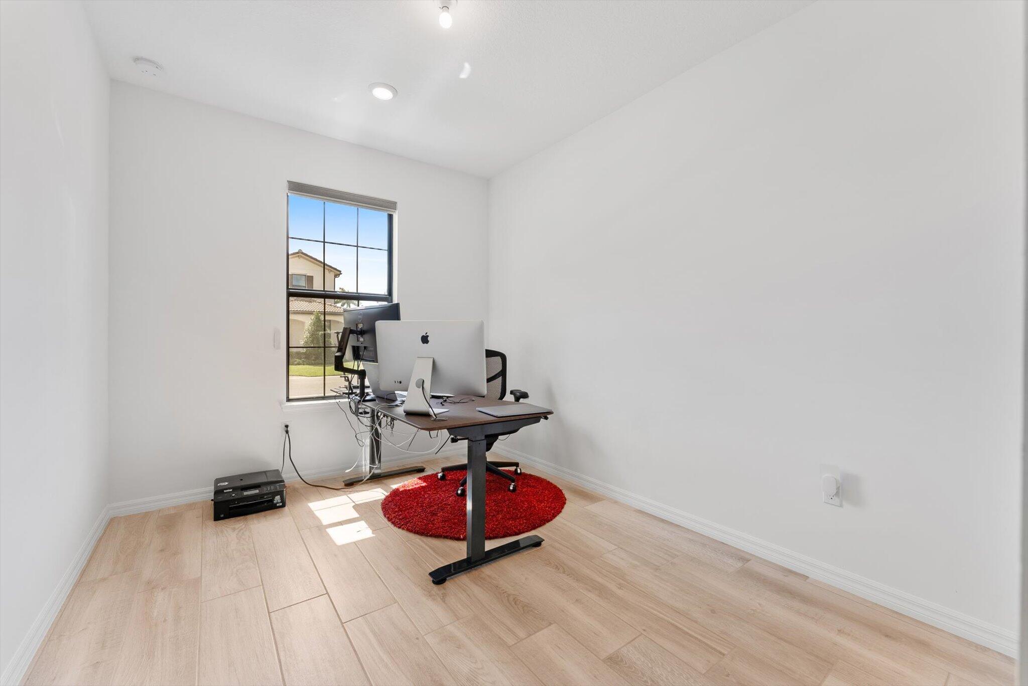 4757 Roldan Court, Unit ROLDAN CT Lake Worth, FL 33467 - Photo 15 of 37 a view of a room with wooden floor and furniture