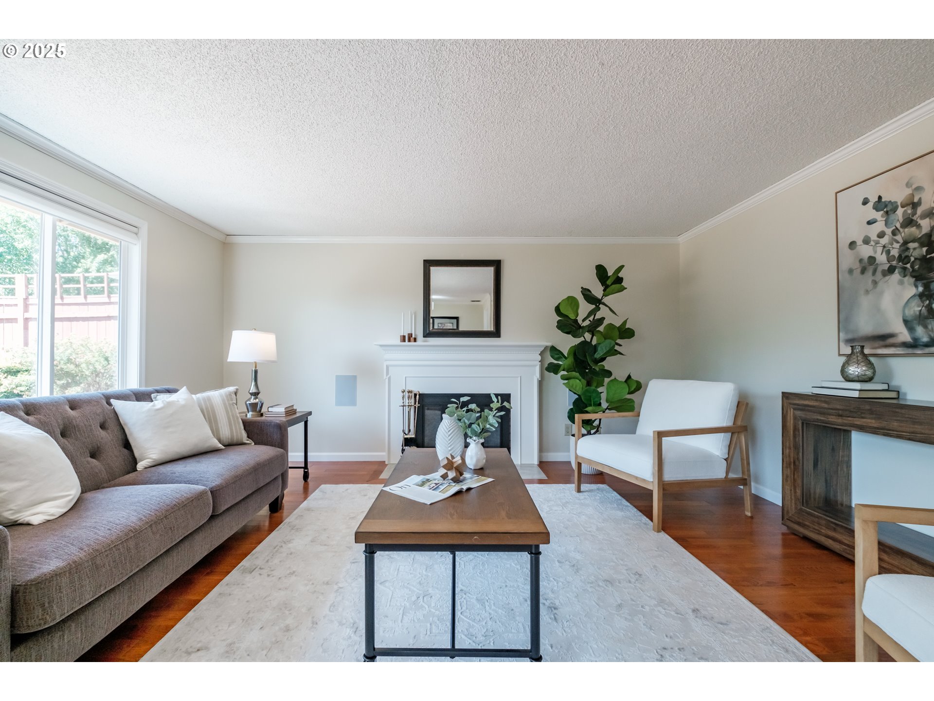 2040 Northwest 23rd Street Corvallis, OR 97330 - Photo 11 of 48 a living room with furniture a fireplace and a potted plant