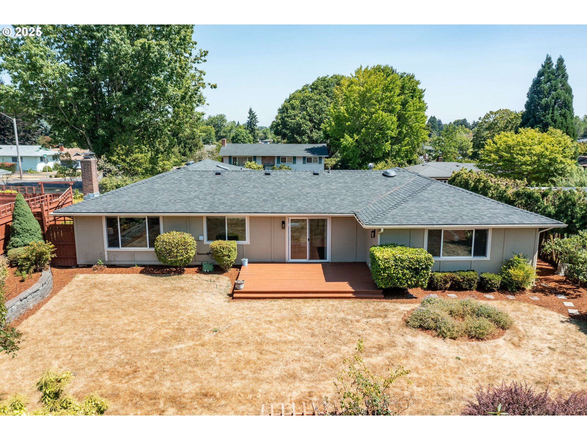 2040 Northwest 23rd Street Corvallis, OR 97330 - Photo 46 of 48 a front view of a house with a yard outdoor seating and garage