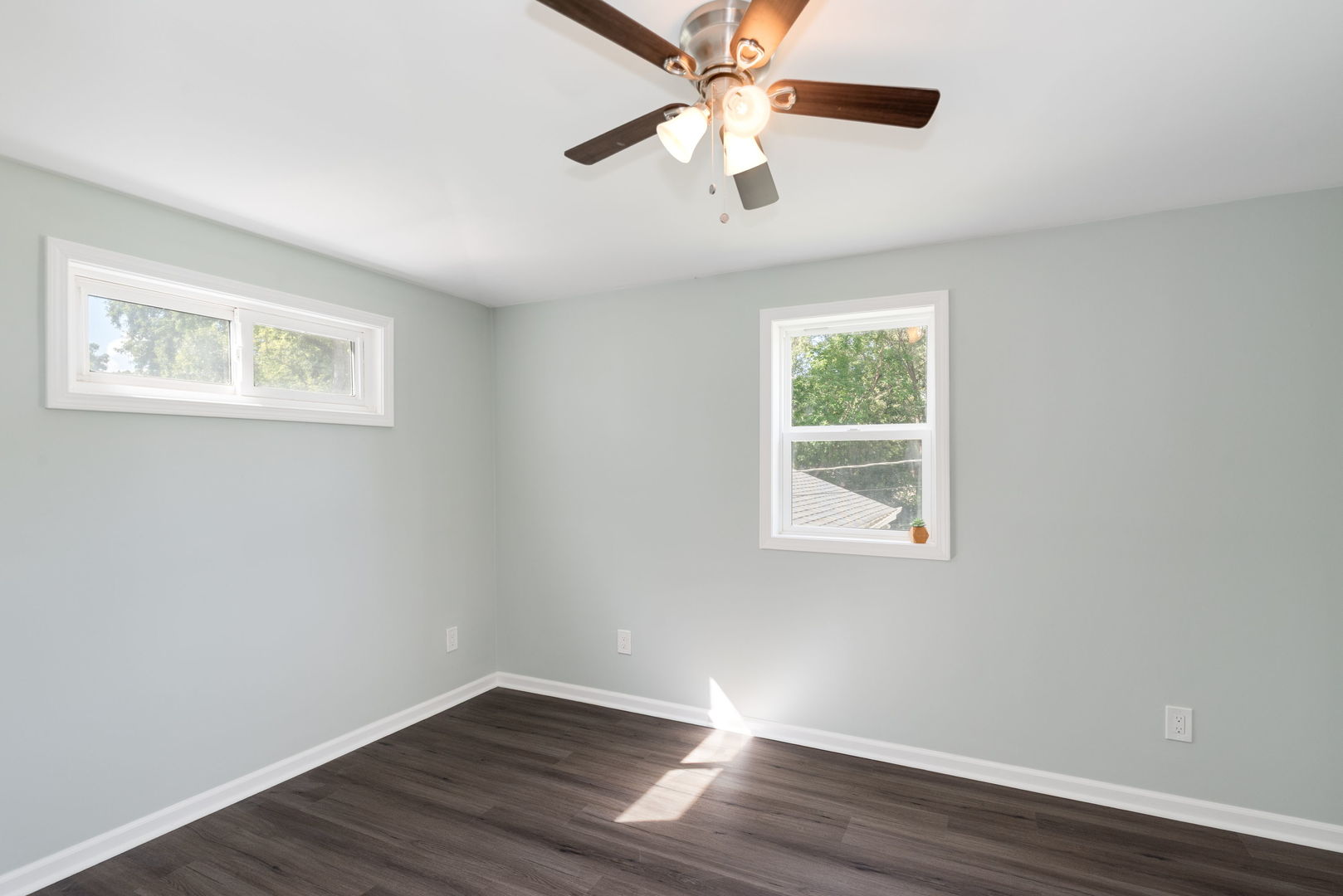 3821 East Wonder Lake Road Wonder Lake, IL 60097 - Photo 11 of 28 a view of an empty room with wooden floor and a window