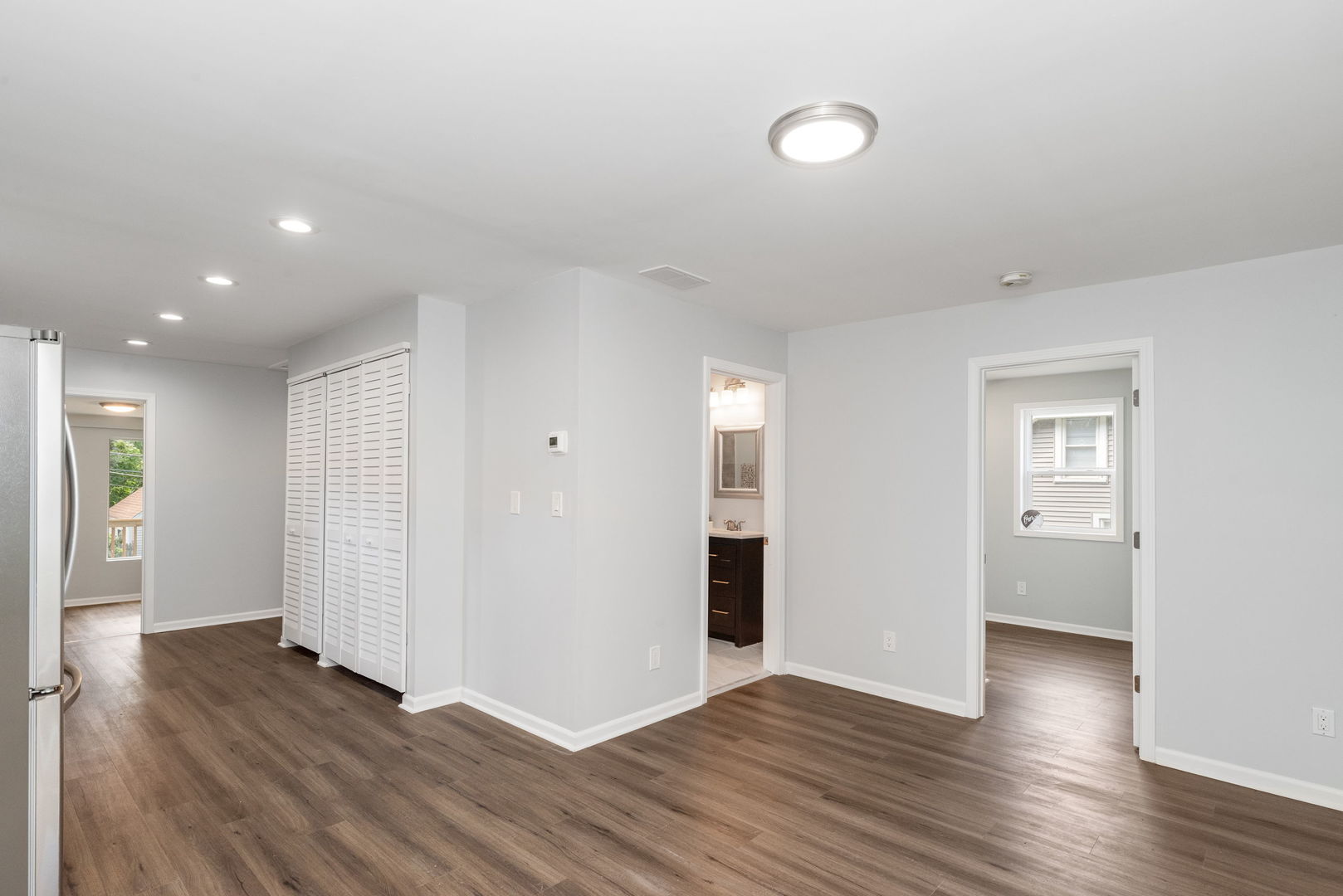 3821 East Wonder Lake Road Wonder Lake, IL 60097 - Photo 15 of 28 a view of an empty room with wooden floor and closet