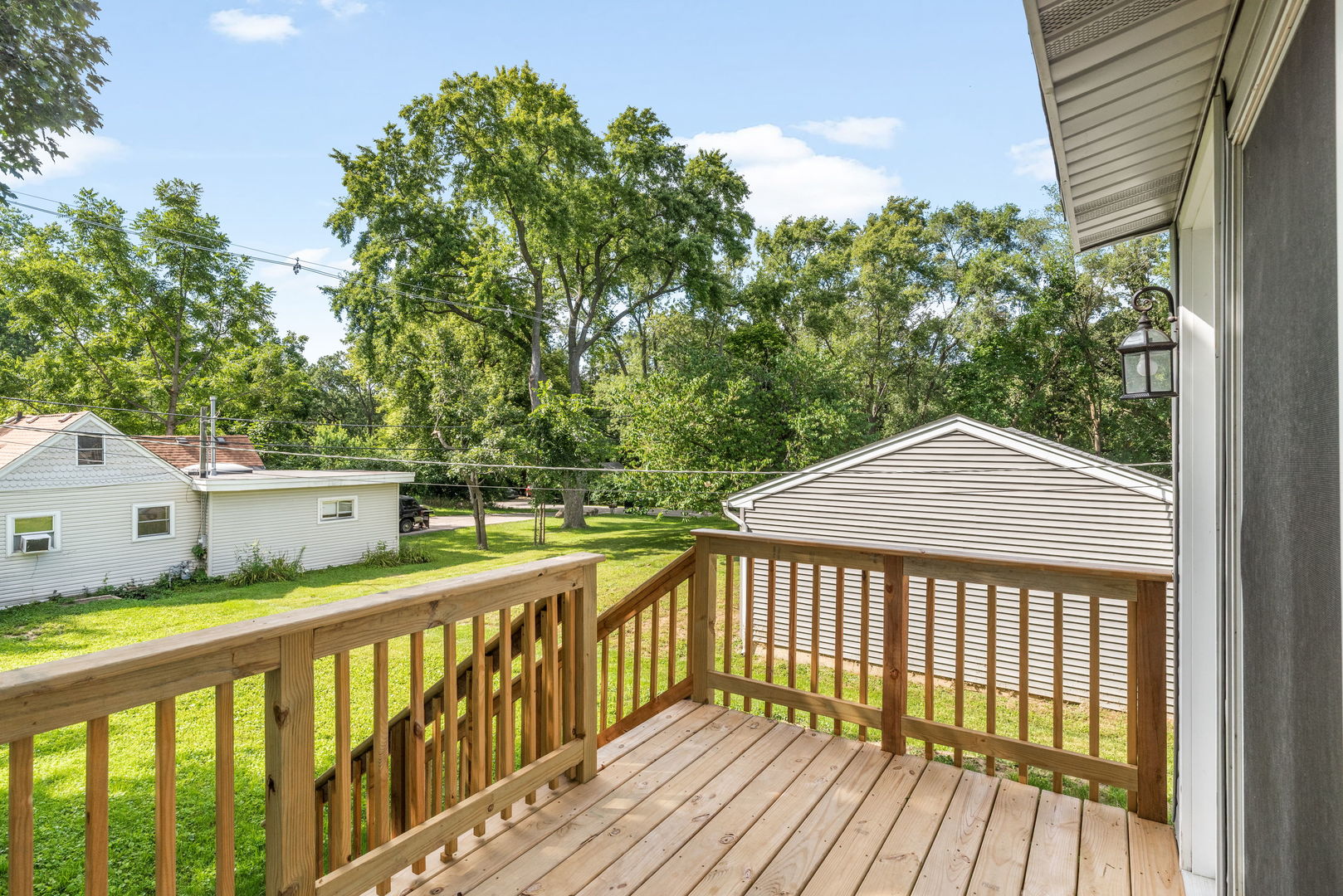 3821 East Wonder Lake Road Wonder Lake, IL 60097 - Photo 18 of 28 a view of a wooden deck and a yard