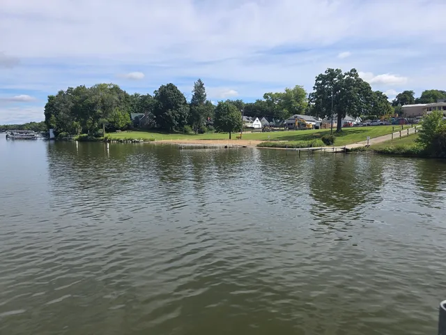 a view of a lake with houses in the back