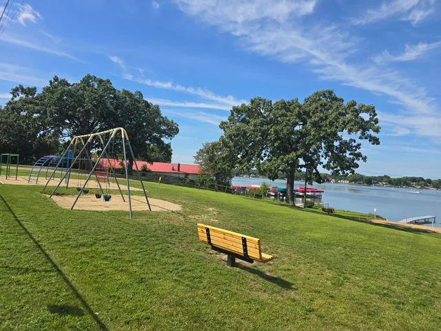 a view of a park with swings and slides