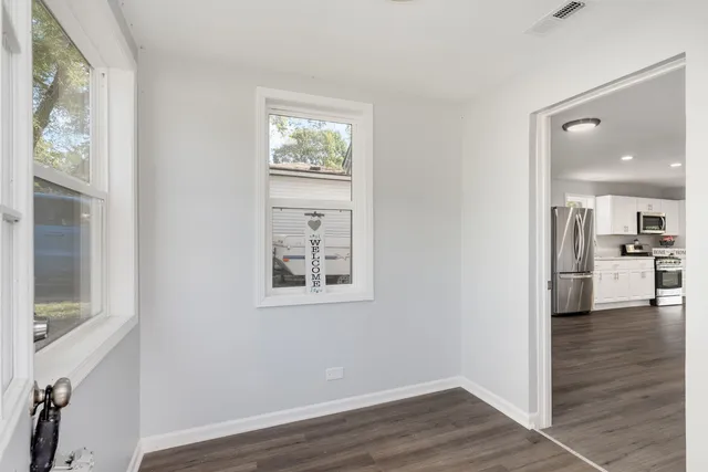 a view of a kitchen cabinets and wooden floor