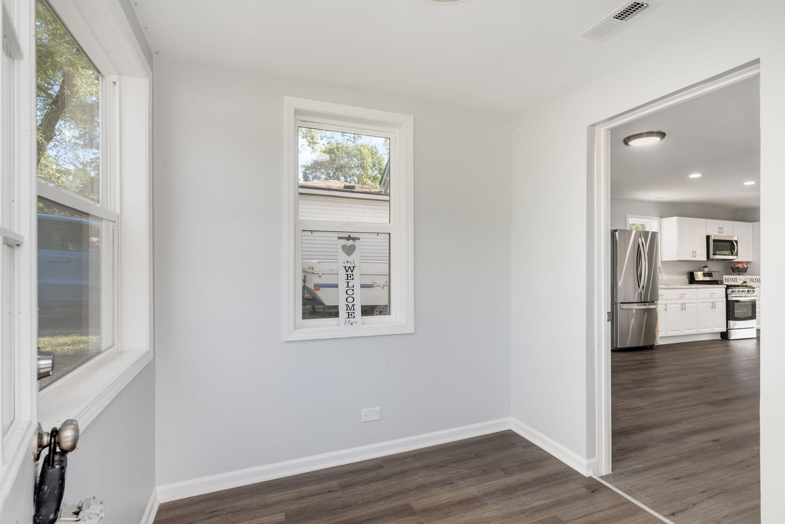 3821 East Wonder Lake Road Wonder Lake, IL 60097 - Photo 3 of 28 a view of a kitchen cabinets and wooden floor