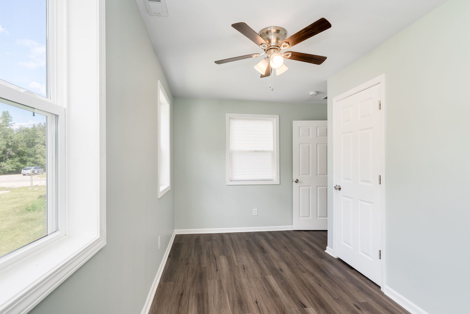 3821 East Wonder Lake Road Wonder Lake, IL 60097 - Photo 5 of 28 an empty room with wooden floor and windows