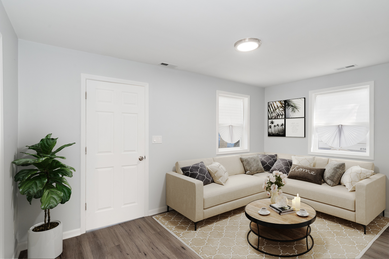 3821 East Wonder Lake Road Wonder Lake, IL 60097 - Photo 8 of 28 a living room with furniture and a potted plant