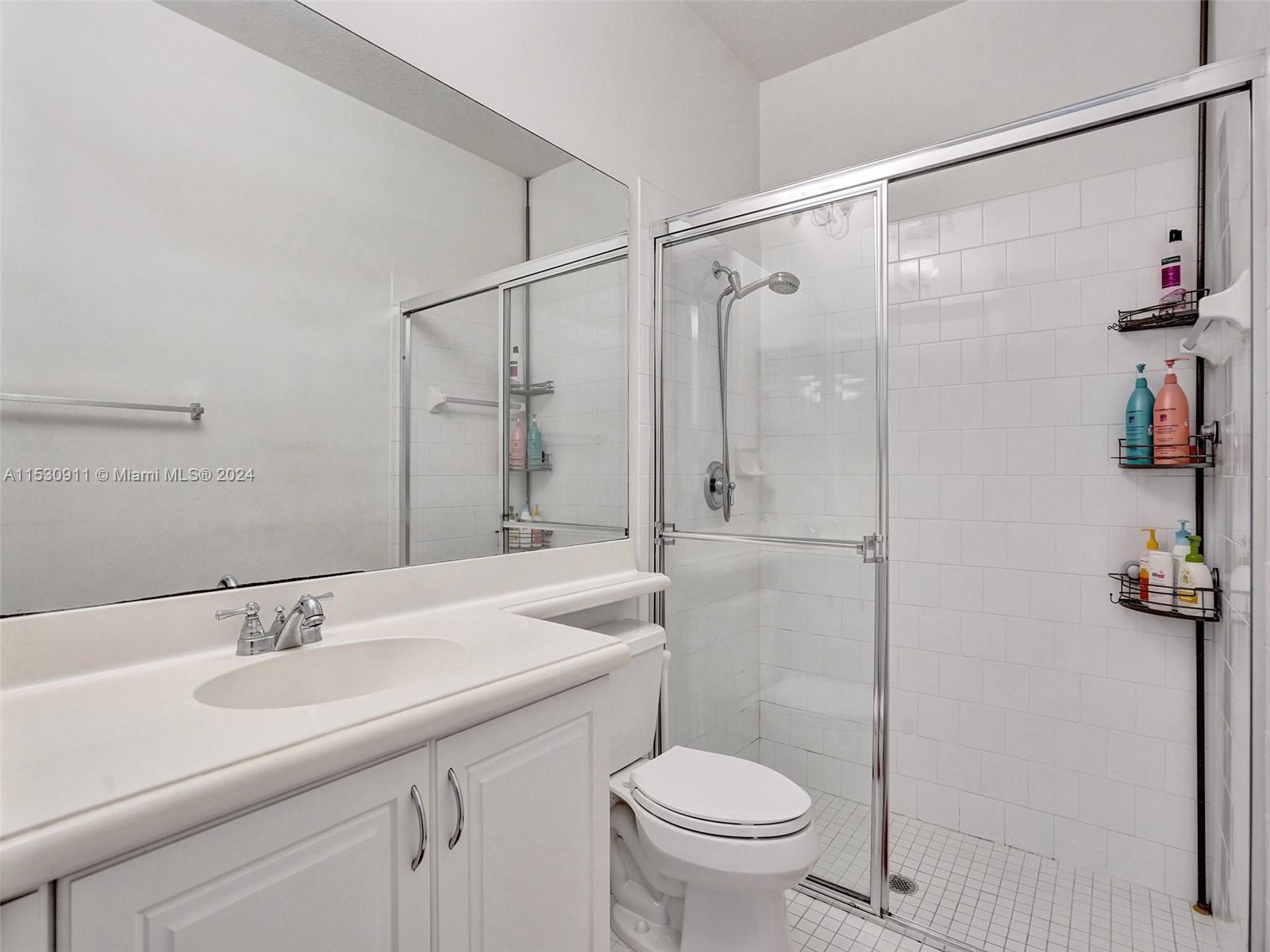 3630 Northwest 5th Terrace, Unit 3630 Boca Raton, FL 33431 - Photo 11 of 31 a bathroom with a sink toilet and shower
