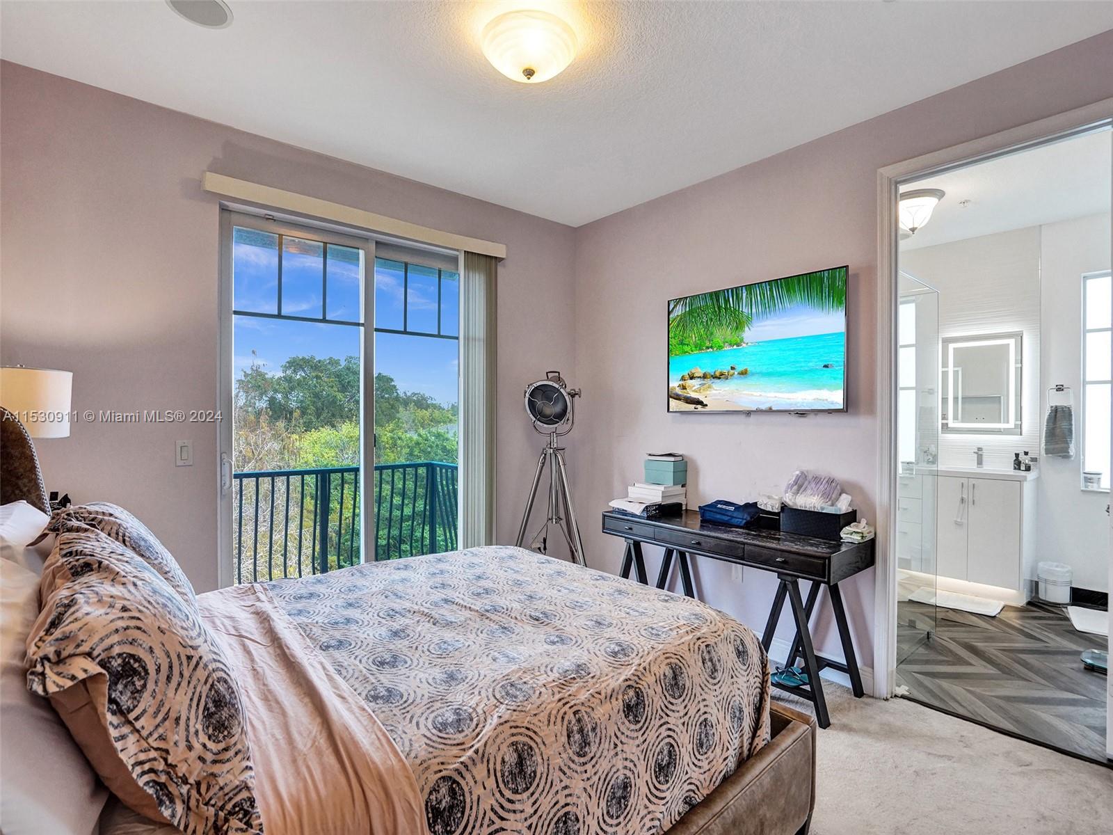 3630 Northwest 5th Terrace, Unit 3630 Boca Raton, FL 33431 - Photo 27 of 31 a bedroom with a bed and a window