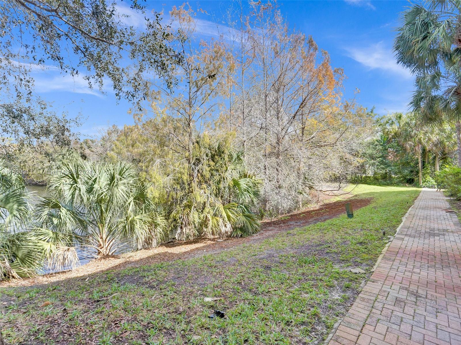 3630 Northwest 5th Terrace, Unit 3630 Boca Raton, FL 33431 - Photo 5 of 31 a view of a yard with an trees
