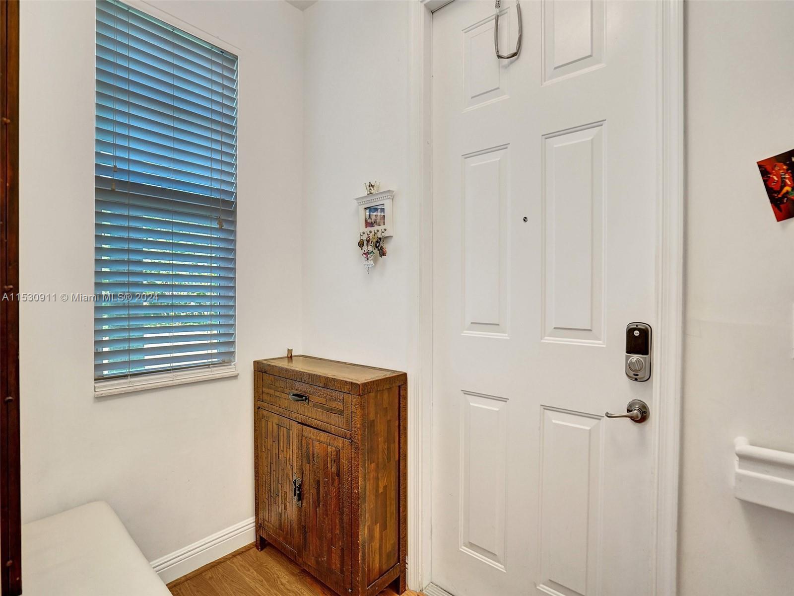 3630 Northwest 5th Terrace, Unit 3630 Boca Raton, FL 33431 - Photo 8 of 31 a view of a hallway with closet and mirror