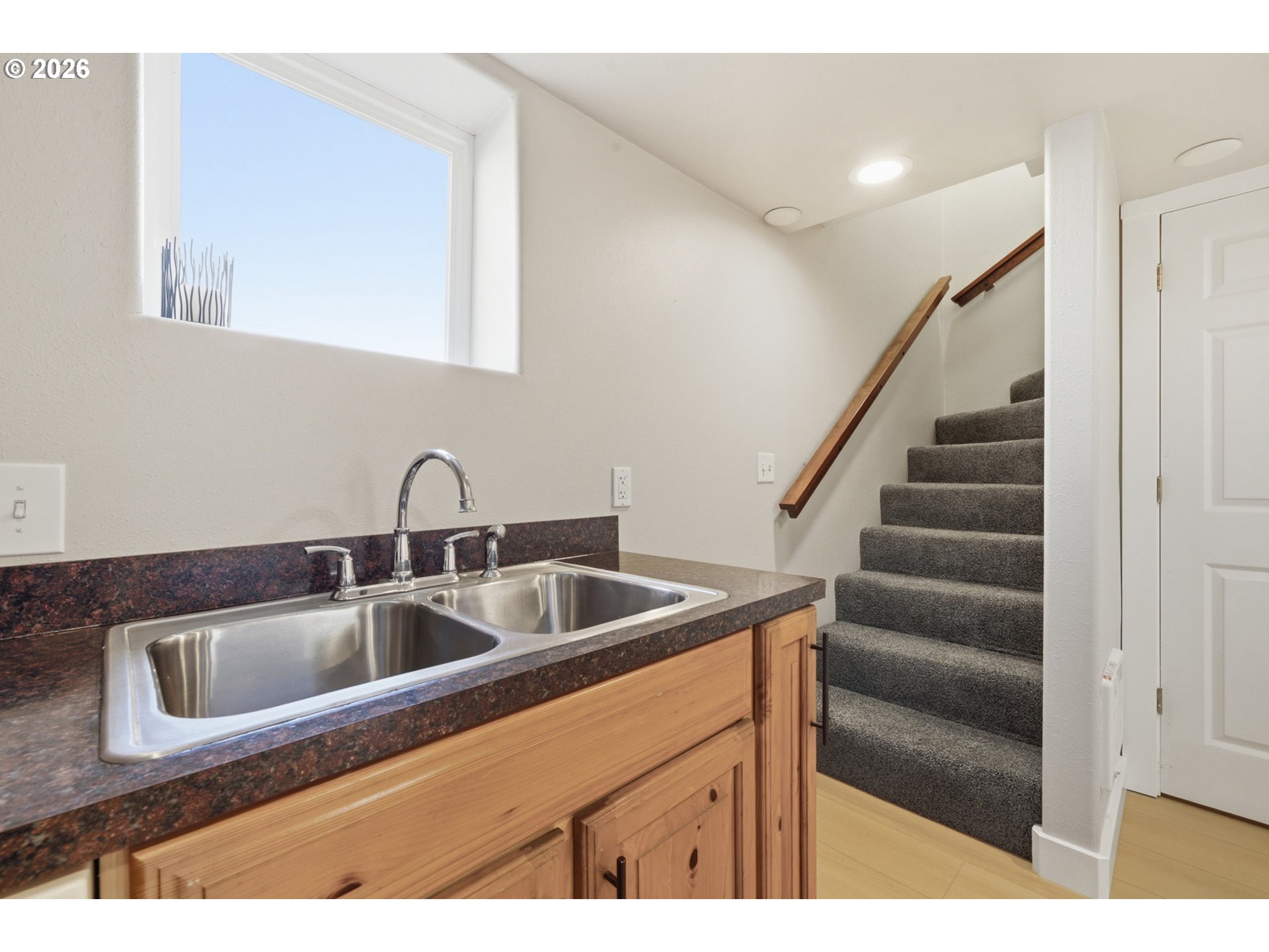 1802 8th Street Tillamook, OR 97141 - Photo 26 of 37 a kitchen with a sink and cabinets