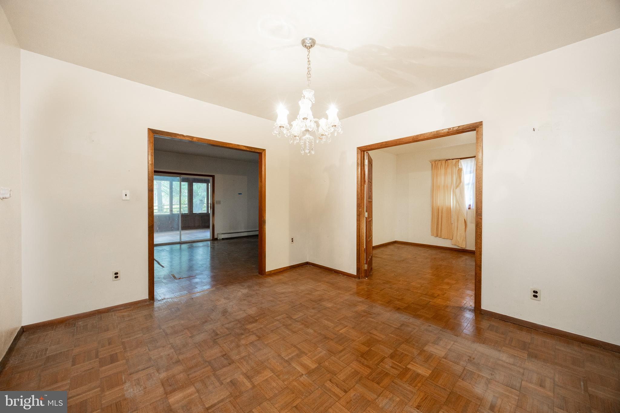 741 Haines Mill Road West Chester, PA 19382 - Photo 12 of 25 an empty room with chandelier fan and windows