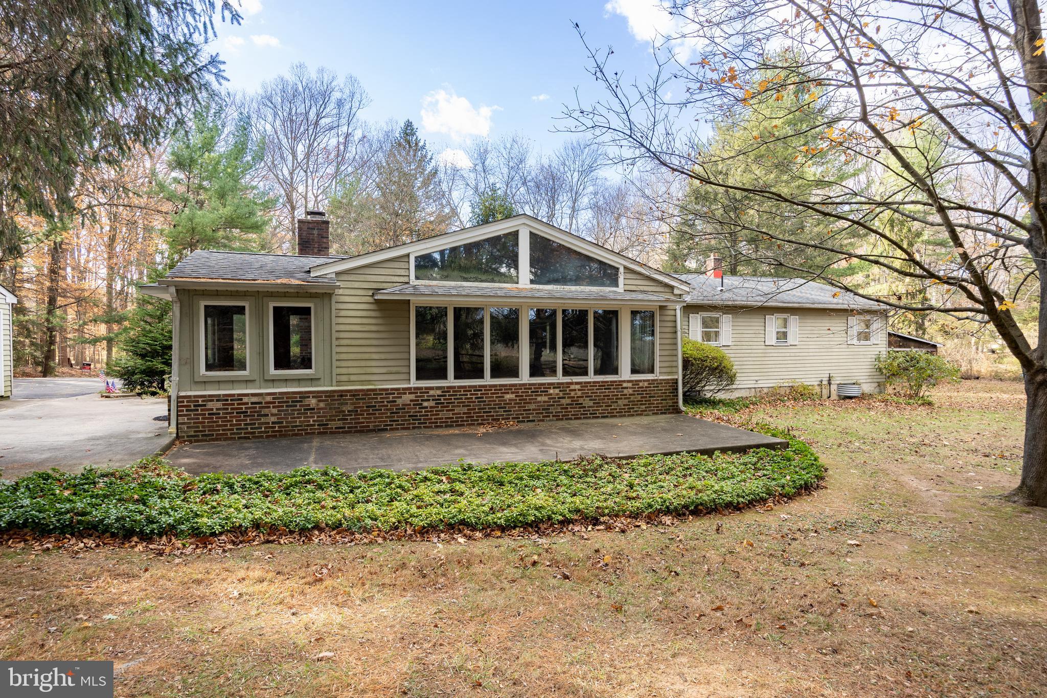 741 Haines Mill Road West Chester, PA 19382 - Photo 7 of 25 a front view of a house with a garden and yard