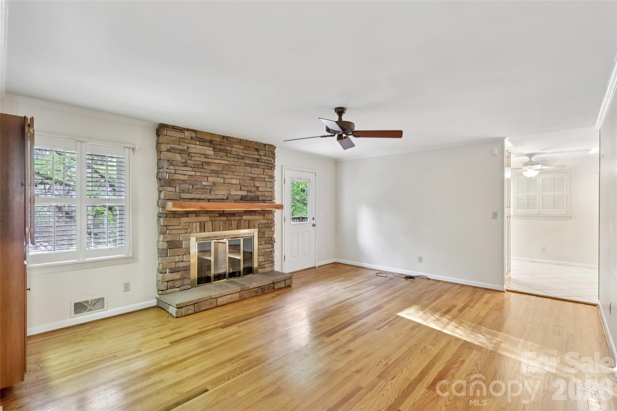 1002 Ridge Street Albemarle, NC 28001 - Photo 11 of 45 a view of empty room with wooden floor and fan